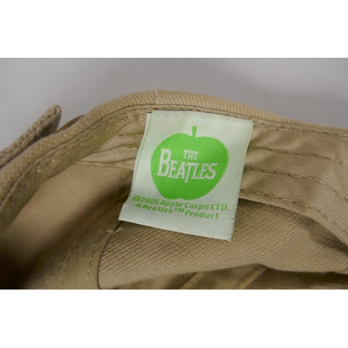 122 - Beatles memorabilia, a Grafton bone china dish, a Sgt Pepper's Lonely Hearts tea towel, a two disk D... 