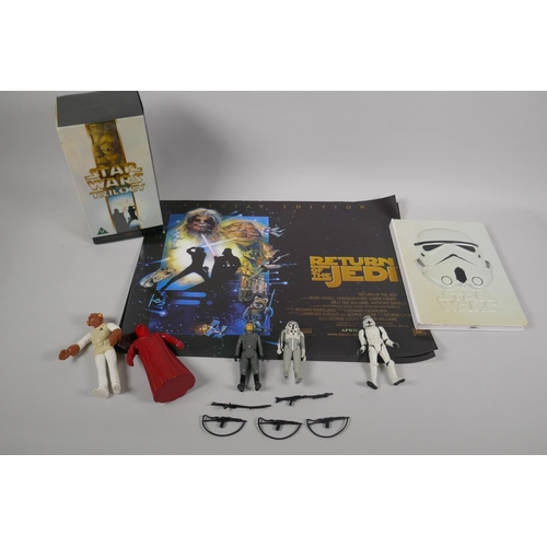 123 - A collection of Star Wars Collectables to include the Star Wars Trilogy digital remaster VHS box set... 