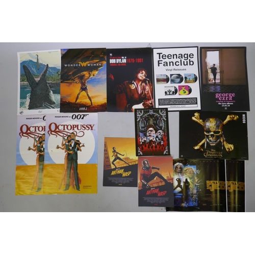 124 - A collection of movie theatre and music promotional posters including Pirates of the Caribbean Salaz... 