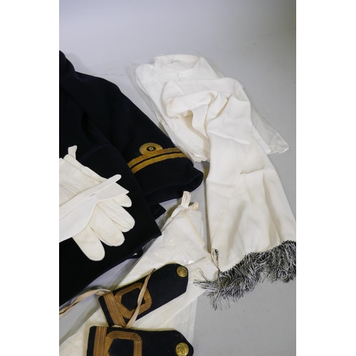 133 - A British Royal Navy Reserve Officer's uniform, cap, belt, mess uniform