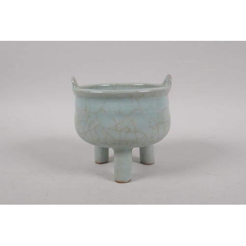 135 - A Chinese celadon crackle glazed censer on tripod supports, 10cm high