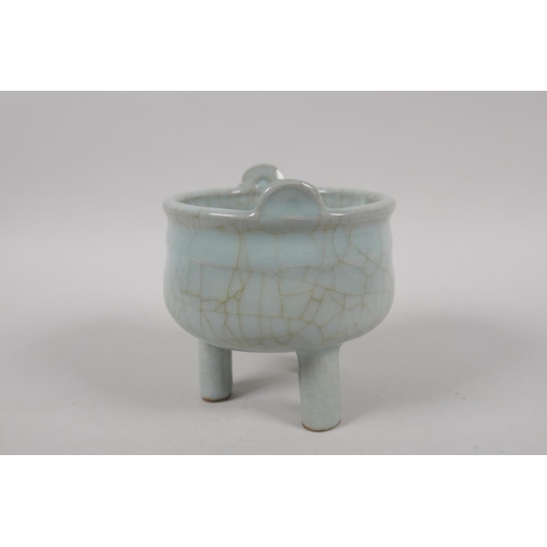 135 - A Chinese celadon crackle glazed censer on tripod supports, 10cm high