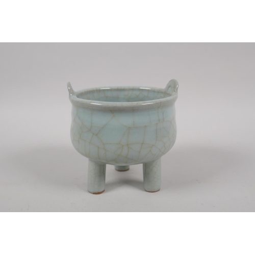 135 - A Chinese celadon crackle glazed censer on tripod supports, 10cm high