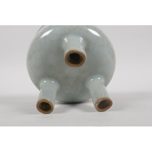 135 - A Chinese celadon crackle glazed censer on tripod supports, 10cm high