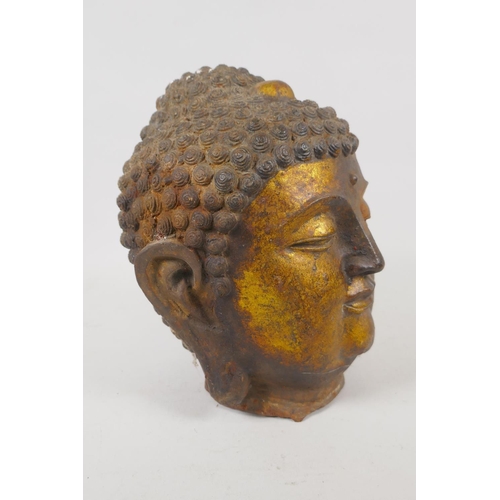 14 - A Sino Tibetan gilt cast metal Buddha head, 20cm high