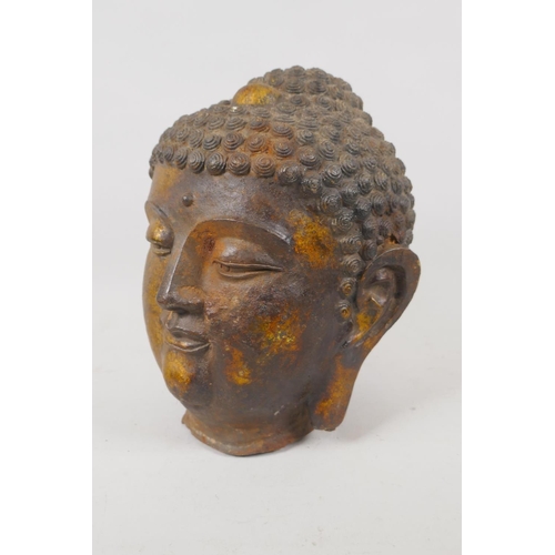 14 - A Sino Tibetan gilt cast metal Buddha head, 20cm high