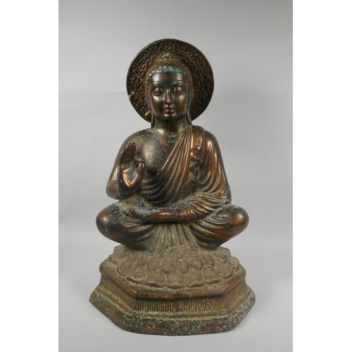 141 - A large Tibetan coppered bronze figure of Buddha, 48cm high