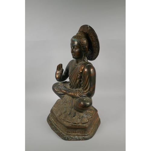 141 - A large Tibetan coppered bronze figure of Buddha, 48cm high