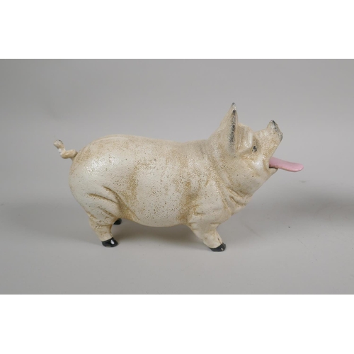 152 - A painted cast iron mechanical piggy bank, 21cm long, and a painted cast iron 'Wise Pig' money box