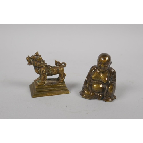 153 - A Chinese miniature bronze incense stick holder in the form of a kylin, and a miniature bronze Buddh... 