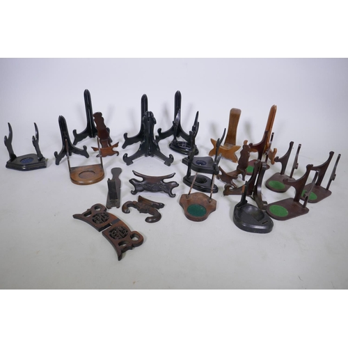 155 - A quantity of Chinese wood stands and a display case, 34 x 29 x 3cm