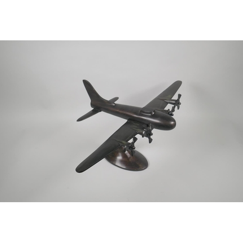 157 - A vintage style bronzed metal desk model of a four engine bomber, wingspan 56cm