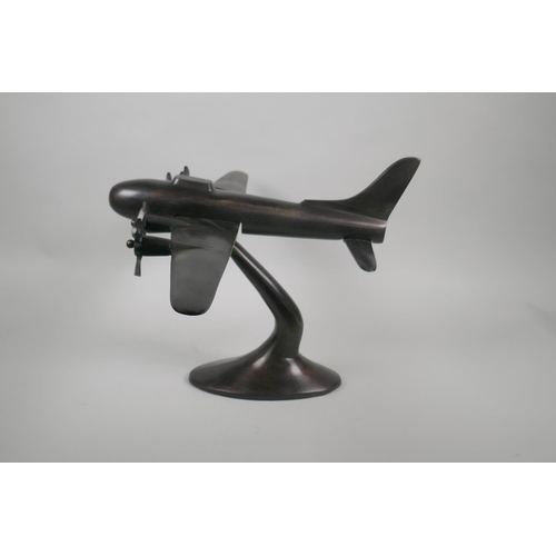 157 - A vintage style bronzed metal desk model of a four engine bomber, wingspan 56cm