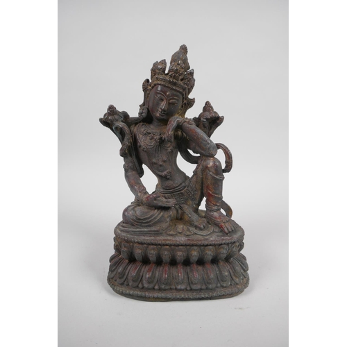 158 - A Tibetan bronzed metal figure of Tara, with the remnants of gilt patina, 19cm high