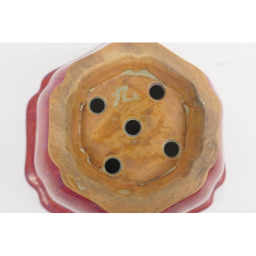 159 - A Chinese Jun ware pottery planter of lobed form with drainage holes to the base, 14cm diameter