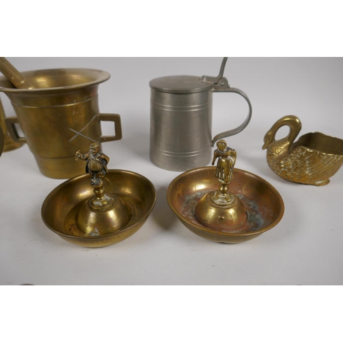 161 - A quantity of antique brass ware to include a pestle and mortar, a pair of two branch candle sconces... 