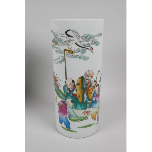 162 - A Chinese polychrome porcelain cylinder vase decorated with Shou Lao amongst children, and another d... 