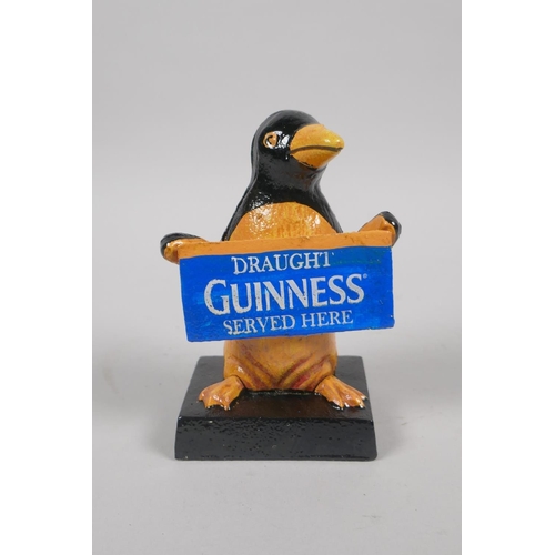 169 - A painted cast iron Penguin Guinness mascot, 12cm high