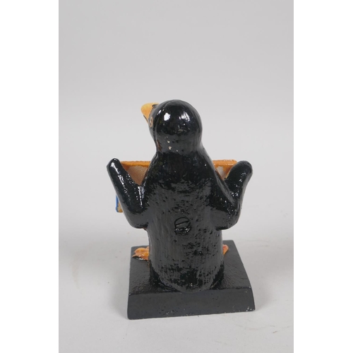 169 - A painted cast iron Penguin Guinness mascot, 12cm high