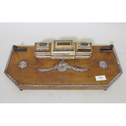 177 - An early C20th walnut desk stand with silver mounts and faux mother of pearl inkwells and stamp box,... 