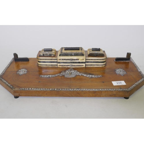 177 - An early C20th walnut desk stand with silver mounts and faux mother of pearl inkwells and stamp box,... 