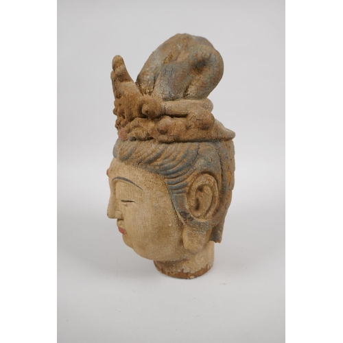 198 - A Chinese carved, painted and distressed wood head bust of Quan Yin, 23cm high