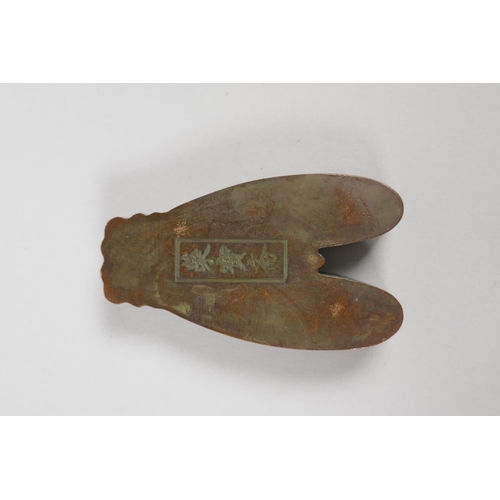 199 - An oriental bronze ink box in the form of a cicada, with character inscription to base, 8cm long