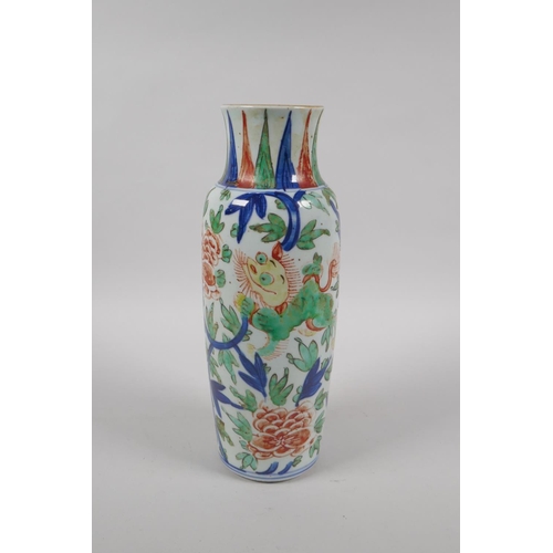 203 - A Chinese Wucai porcelain vase with kylin and floral decoration, 26cm high