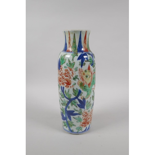 203 - A Chinese Wucai porcelain vase with kylin and floral decoration, 26cm high