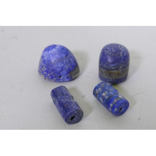 205 - Four lapis lazuli pendant seals, largest 2.5cm