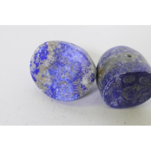 205 - Four lapis lazuli pendant seals, largest 2.5cm