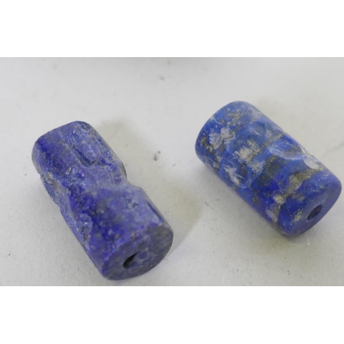 205 - Four lapis lazuli pendant seals, largest 2.5cm