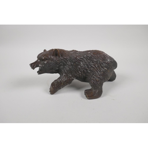 207 - A filled bronze figure of a bear, 20cm long