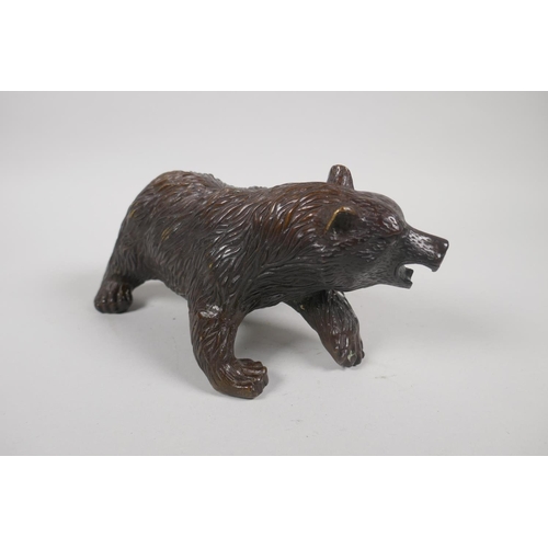 207 - A filled bronze figure of a bear, 20cm long