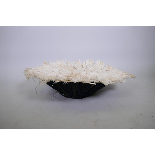 212 - An African white feather Juju hat