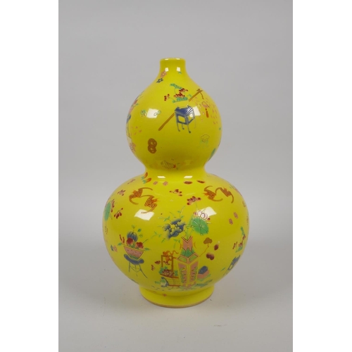 222 - A Chinese yellow ground porcelain double gourd vase decorated with objects of virtue, GuangXu 6 char... 