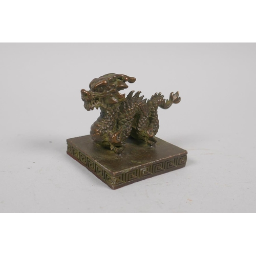 224 - A Chinese square form bronze dragon seal, 5 x 5cm