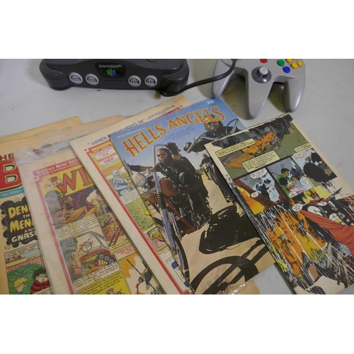 232 - A Nintendo 64 control deck and controller, Action Man and children's annual and comics