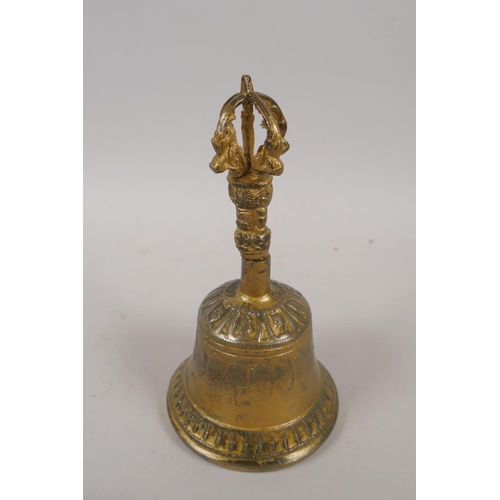 240 - A Tibetan gilt metal ceremonial bell with a vajra handle and a pair of ceremonial cymbals, 16cm