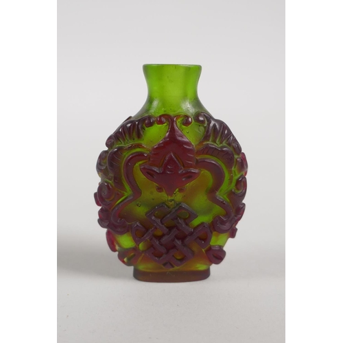 242 - Three Chinese glass snuff bottles, largest 8cm high