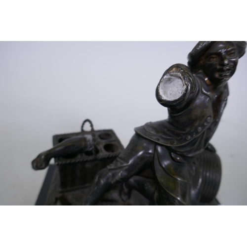 244 - C19th French ebony and spelter smoker's companion, with two spring loaded drawers, one with fitted v... 