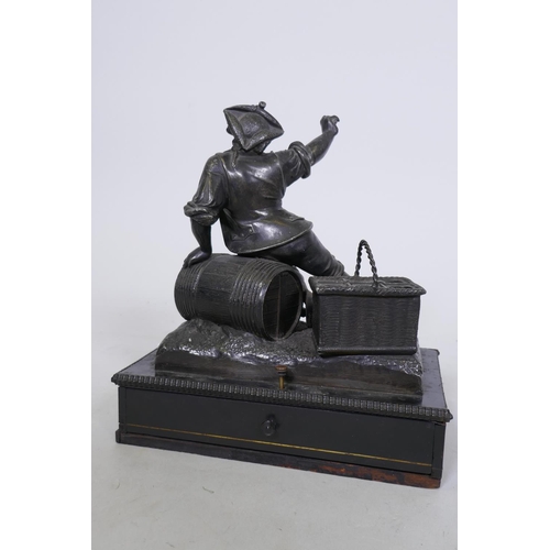 244 - C19th French ebony and spelter smoker's companion, with two spring loaded drawers, one with fitted v... 