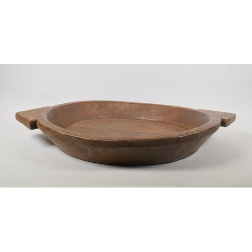 248 - A vintage carved wood dough bowl, 48cm diameter