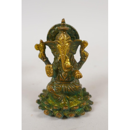 253 - Two Tibetan bronze figures of Buddha and Tara, and an Indian bronze figure of Ganesh, largest 9cm hi... 