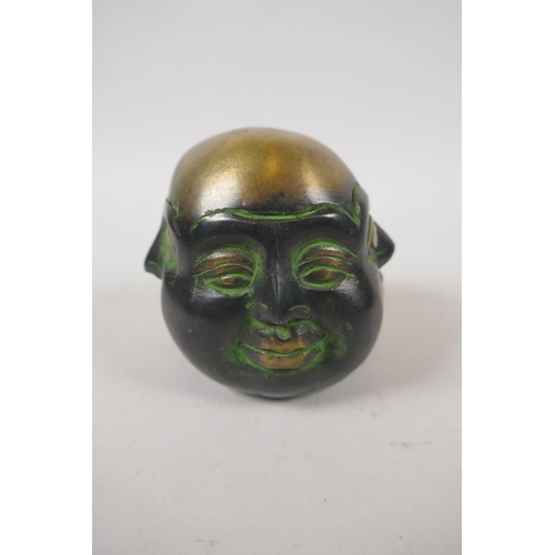 259 - A Chinese bronze four face Buddha head, 8cm