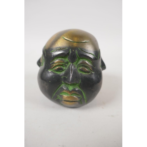 259 - A Chinese bronze four face Buddha head, 8cm