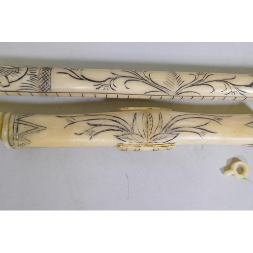 26 - An imitation bone Sumatran style blow gun with carved decoration, 120cm long