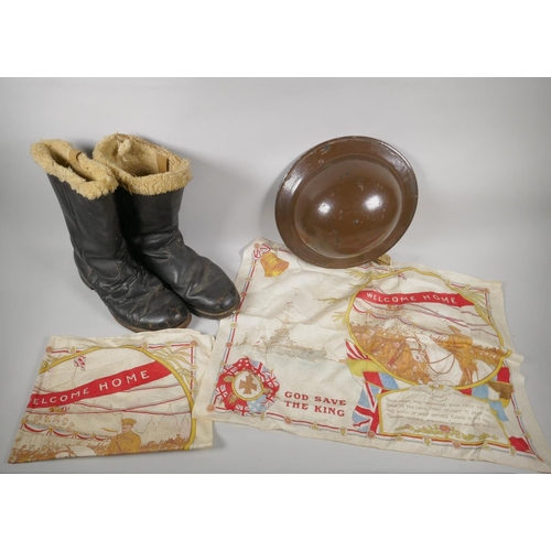 34 - A WWII British civil defence helmet, a pair of WWII sheep skin lined leather pilot's boots and a pai... 