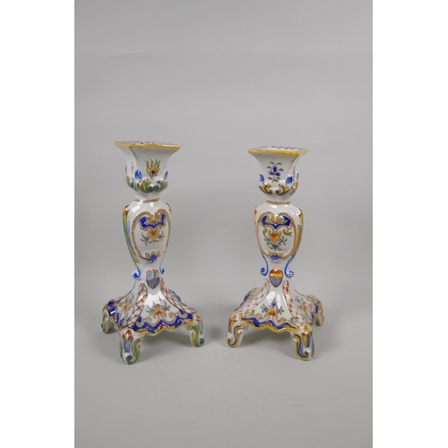 36 - A pair of antique French Faience Quimper pottery candlesticks, and a similar twin section desk stand... 