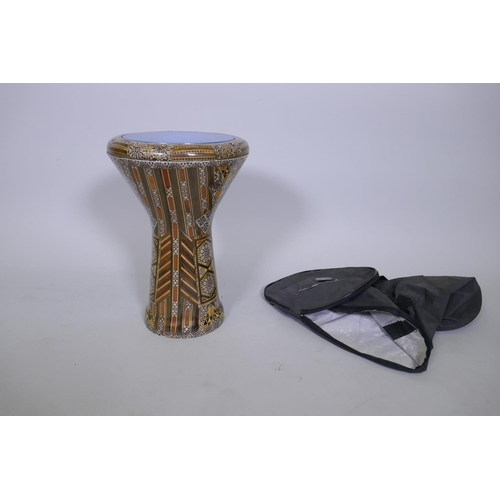 40 - A Syrian terracotta doumbek drum with exotic wood veneers and carry case, 40cm high